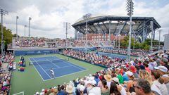 A general view of the packed viewing areas on the outside courts as Sebastian Korda of the United States plays against Facundo Bagnis of Argentina on Court Four with the backdrop of Arthur Ashe Stadium on day one of the US Open Tennis Championship 2022.