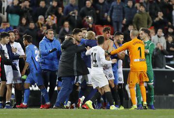 Valencia and Getafe players were involved in a brawl at the end of their Copa del Rey match that saw Valencia score twice in 45 seconds to go through.