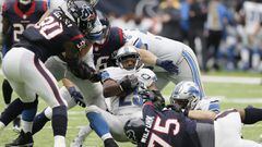 HOUSTON, TX - OCTOBER 30: Theo Riddick #25 of the Detroit Lions is tackled by Vince Wilfork #75 of the Houston Texans in the third quarter at NRG Stadium on October 30, 2016 in Houston, Texas.   Thomas B. Shea/Getty Images/AFP == FOR NEWSPAPERS, INTERNET, TELCOS &amp; TELEVISION USE ONLY ==