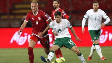 Serbia&#039;s Uros Racic, left, and Ireland&#039;s Jayson Molumby challenge for the ball during the World Cup 2022 group A qualifying soccer match between Serbia and Ireland at the Rajko Mitic stadium in Belgrade, Serbia, Wednesday, March 24, 2021. (AP Ph