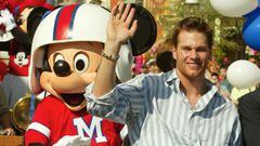 New England Patriots quarterback Tom Brady (R) and Mickey Mouse wave to the crowd during a parade at Disney World in Brady&#039;s honor on February 2, 2004 in Lake Buena Vista, Florida.  Brady was named Most Valuable Player in the Patriots&#039; 32-29 victory over the North Carolina Panthers in Super Bowl XXXVIII.  REUTERS/Charles W. Luzier