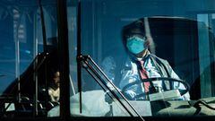 A bus driver wearing face masks is seen during the outbreak of the coronavirus disease (COVID-19) in New York City, U.S., April 17, 2020. REUTERS/Jeenah Moon