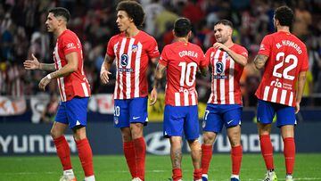 Atletico Madrid players celebrate their win at the end of the Spanish Liga football match between Club Atletico de Madrid and Cadiz CF at the Metropolitano stadium in Madrid on October 1, 2023. (Photo by JAVIER SORIANO / AFP)