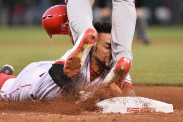 Billy Hamilton flies into Jhonny Peralta's legs in a match between the Cincinnati Reds and St. Louis Cardinals.