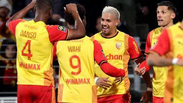 Lens' Argentine defender #14 Facundo Medina (2nd R) celebrates with team mates after scoring a goal during the French L1 football match between Lens and Nantes at Bollaert-Delelis stadium in Lens on October 28, 2023. (Photo by FRANCOIS LO PRESTI / AFP)