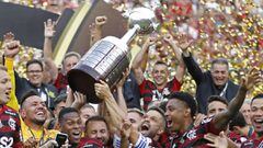 (FILES) In this file photo taken on November 23, 2019 players of Brazil&#039;s Flamengo celebrate on the podium with the trophy after winning the Copa Libertadores final football match by defeating Argentina&#039;s River Plate, at the Monumental stadium i