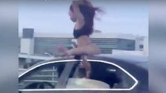 Una mujer hace twerking encima de un coche en plena autopista. Imagen: Twitter