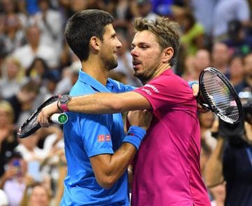 Djokovic embraces Wawrinka at the end of the match.