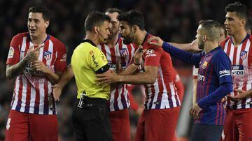 Costa remonstrates with referee Jesús Gil Manzano after being shown a straight red card at the Camp Nou.