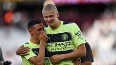 Manchester City's Norwegian striker Erling Haaland (R) and Manchester City's English midfielder Phil Foden (L) celebrate on the pitch after the English Premier League football match between West Ham United and Manchester City at the London Stadium, in London on August 7, 2022. - Man City won the game 2-0. - RESTRICTED TO EDITORIAL USE. No use with unauthorized audio, video, data, fixture lists, club/league logos or 'live' services. Online in-match use limited to 120 images. An additional 40 images may be used in extra time. No video emulation. Social media in-match use limited to 120 images. An additional 40 images may be used in extra time. No use in betting publications, games or single club/league/player publications. (Photo by JUSTIN TALLIS / AFP) / RESTRICTED TO EDITORIAL USE. No use with unauthorized audio, video, data, fixture lists, club/league logos or 'live' services. Online in-match use limited to 120 images. An additional 40 images may be used in extra time. No video emulation. Social media in-match use limited to 120 images. An additional 40 images may be used in extra time. No use in betting publications, games or single club/league/player publications. / RESTRICTED TO EDITORIAL USE. No use with unauthorized audio, video, data, fixture lists, club/league logos or 'live' services. Online in-match use limited to 120 images. An additional 40 images may be used in extra time. No video emulation. Social media in-match use limited to 120 images. An additional 40 images may be used in extra time. No use in betting publications, games or single club/league/player publications. (Photo by JUSTIN TALLIS/AFP via Getty Images)