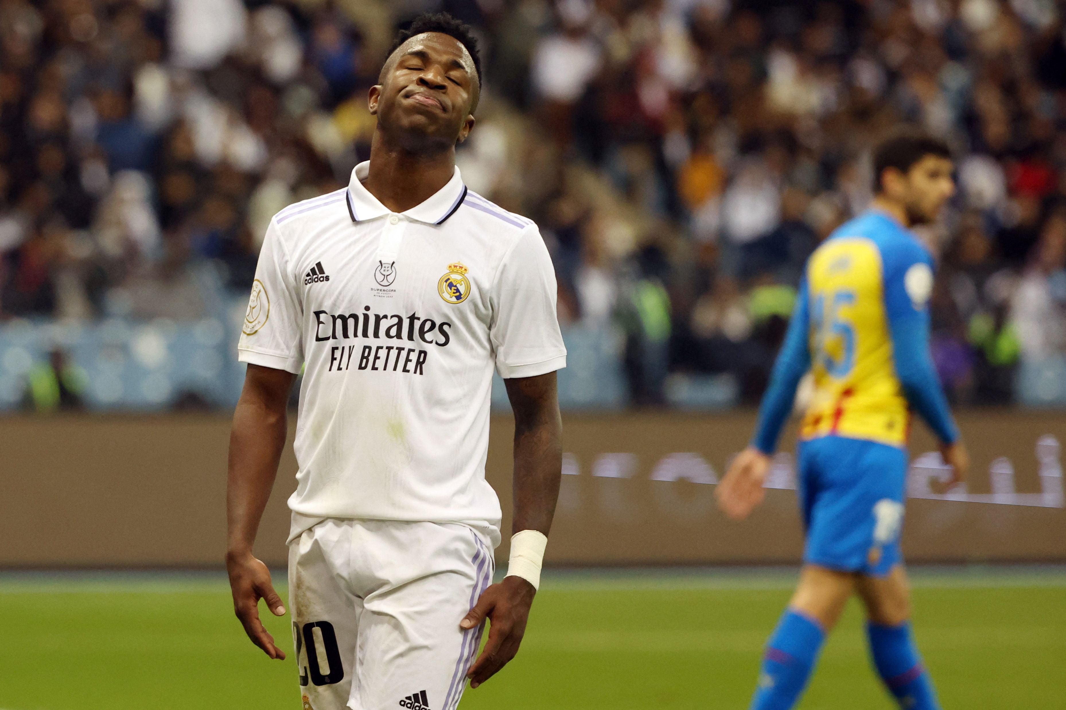 Real Madrid's Brazilian forward Vinicius Junior reacts during the Spanish Super Cup semi-final football match between Real Madrid CF and Valencia CF at the King Fahd International Stadium in Riyadh, Saudi Arabia, on January 11, 2023. (Photo by Giuseppe CACACE / AFP)