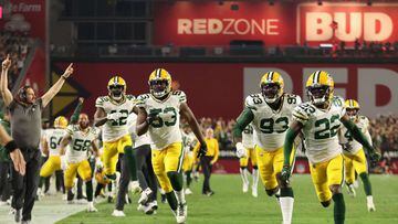 Aaron Rodgers and the Green Bay Packers handed the Arizona Cardinals their first loss of the season despite having two top receivers on the COVID list.
