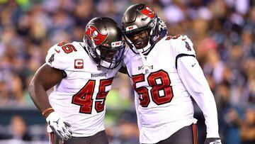 PHILADELPHIA, PENNSYLVANIA - OCTOBER 14: Inside linebacker Devin White #45 and outside linebacker Shaquil Barrett #58 of the Tampa Bay Buccaneers celebrate after stopping the Philadelphia Eagles offense in the second half at Lincoln Financial Field on Oct