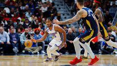 Feb 5, 2023; New Orleans, Louisiana, USA; Sacramento Kings guard Davion Mitchell (15) looks to pass against New Orleans Pelicans center Willy Hernangomez (9) during the second quarter at Smoothie King Center. Mandatory Credit: Andrew Wevers-USA TODAY Sports
