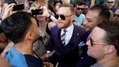 UFC lightweight champion Conor McGregor (C) of Ireland has words with former sparring partner Paulie Malignaggi (L) after his arrival at Toshiba Plaza in Las Vegas, Nevada U.S. on August 22, 2017. REUTERS/Las Vegas Sun/Steve Marcus
