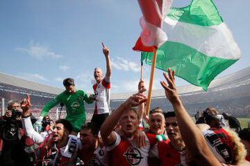 Dirk Kuyt leads the celebrations with team mates and fans at Stadion Feijenoord on Sunday.
