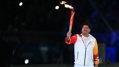 Chile's former footballer Ivan Zamorano carries the torch to light the Cauldron of the Pan American Games Santiago 2023 during the opening ceremony, at the National Stadium in Santiago on October 20, 2023. (Photo by RAUL ARBOLEDA / AFP)