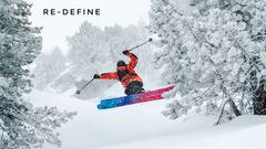 Portada de Re-Define, con el esquiador Álvaro Penadés saltando en una montaña muy nevada, entre árboles.