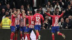 Atletico Madrid's Spanish midfielder #14 Marcos Llorente (2nd-R) celebrates with teammates after scoring his team's first goal during the Spanish league football match between Real Madrid CF and Club Atletico de Madrid at the Santiago Bernabeu stadium in Madrid on February 4, 2024. (Photo by Thomas COEX / AFP)