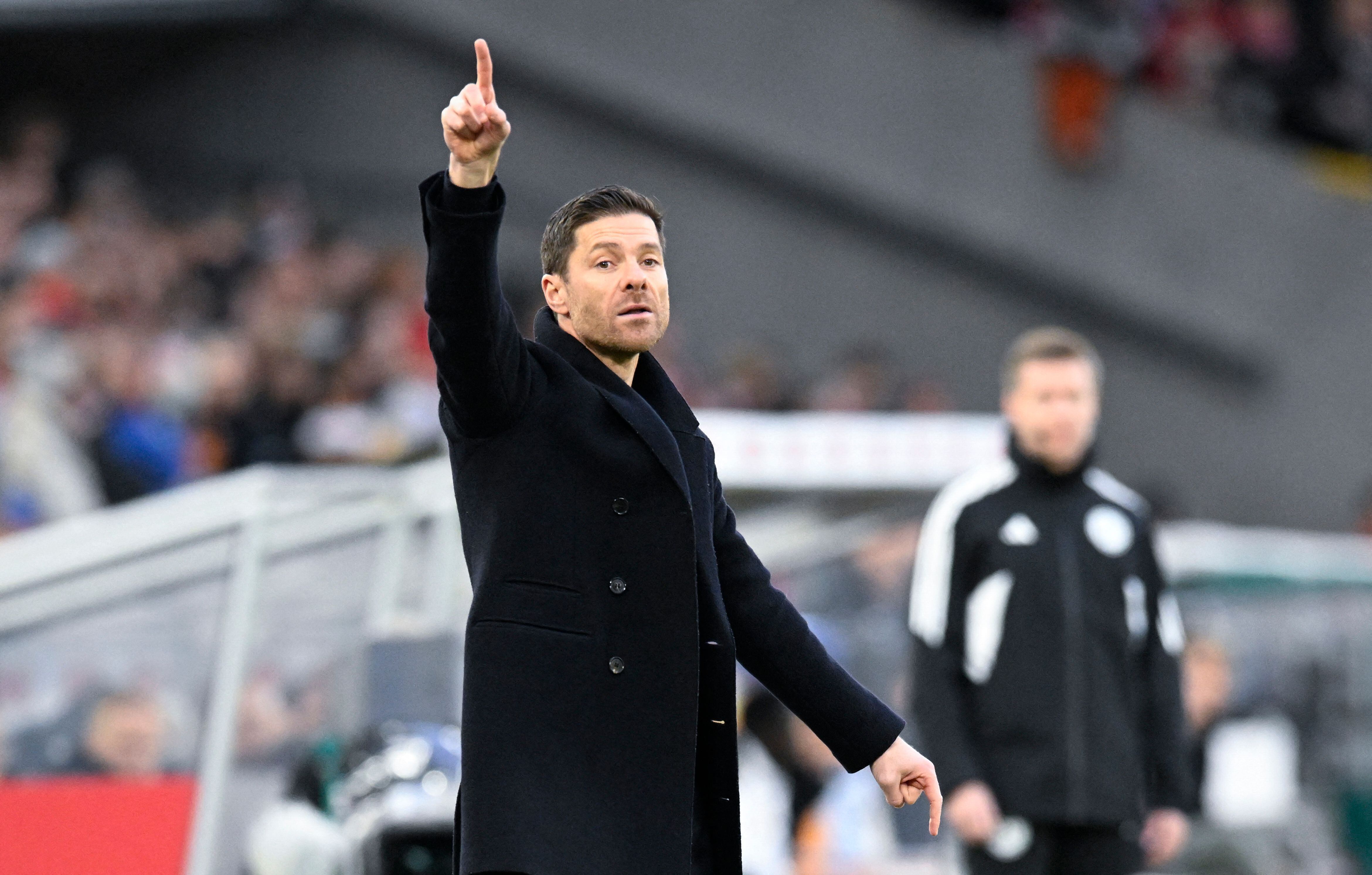 Bayer Leverkusen's Spanish coach Xabi Alonso reacts during the German first division Bundesliga football match between VfB Stuttgart and Bayer Leverkusen in Stuttgart, southern Germany, on December 10, 2023. (Photo by THOMAS KIENZLE / AFP) / DFL REGULATIONS PROHIBIT ANY USE OF PHOTOGRAPHS AS IMAGE SEQUENCES AND/OR QUASI-VIDEO