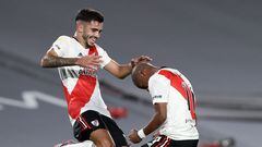 River Plate's Uruguayan midfielder Nicolas De La Cruz (R) celebrates with midfielder Santiago Simon after scoring the team's second goal against Racing Club during their Argentine Professional Football League match at El Monumental stadium in Buenos Aires, on February 27, 2022. (Photo by ALEJANDRO PAGNI / AFP)