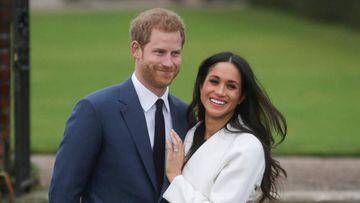(FILES) In this file photo taken on November 27, 2017 Britain&#039;s Prince Harry and his fiancxE9e US actress Meghan Markle pose for a photograph in the Sunken Garden at Kensington Palace in west London, following the announcement of their engagement. - Prince Harry and Meghan Markle officially launched their new Hollywood careers on September 2, 2020, signing a deal with Netflix to produce &quot;impactful&quot; films and series for the streaming giant. (Photo by Daniel LEAL-OLIVAS / AFP)