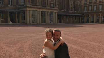 David Beckham con su hija Harper en el Buckingham Palace