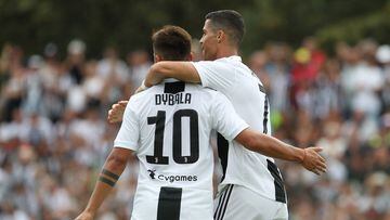 VILLAR PEROSA, ITALY - AUGUST 12:  Cristiano Ronaldo (R) of Juventus celebrates with his team-mate Paulo Dybala (L) after scoring the opening goal during the Pre-Season Friendly match between Juventus and Juventus U19 on August 12, 2018 in Villar Perosa, Italy.  (Photo by Marco Luzzani/Getty Images)
