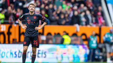 17 September 2022, Bavaria, Augsburg: Soccer: Bundesliga, FC Augsburg - Bayern Munich, Matchday 7, WWK Arena. Munich's Thomas Müller reacts unhappily. Photo: Tom Weller/dpa - IMPORTANT NOTE: In accordance with the requirements of the DFL Deutsche Fußball Liga and the DFB Deutscher Fußball-Bund, it is prohibited to use or have used photographs taken in the stadium and/or of the match in the form of sequence pictures and/or video-like photo series. (Photo by Tom Weller/picture alliance via Getty Images)