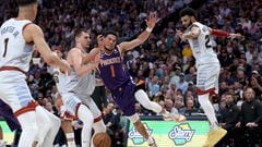 Devin Booker #1 of the Phoenix Suns is stripped going to the basket by Nikola Jokic #15 of the Denver Nuggets in the third quarter during Game Five of the NBA Western Conference Semifinals at Ball Arena on May 09, 2023 in Denver, Colorado.