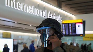 A man wears a face covering at Heathrow Terminal 2 on November 28, 2021 in London, England. Following the discovery of a new Covid-19 variant, whose mutations  suggest greater transmissibility than previous virus strains, the United Kingdom imposed new re