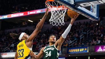 Jan 27, 2023; Indianapolis, Indiana, USA; Milwaukee Bucks forward Giannis Antetokounmpo (34) shoots the ball while Indiana Pacers center Myles Turner (33) defends in the second half at Gainbridge Fieldhouse. Mandatory Credit: Trevor Ruszkowski-USA TODAY Sports