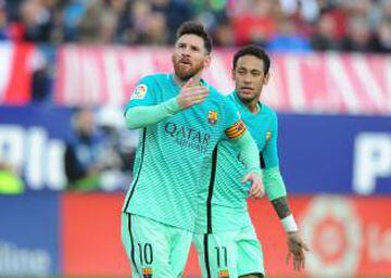 Lionel Messi of FC Barcelona celebrates with Neymar after scoring his 2nd goal during the La Liga match between Club Atletico de Madrid and FC Barcelona at Vicente Calderon Stadium on February 26, 2017 in Madrid, Spain.