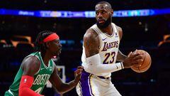 Dec 25, 2023; Los Angeles, California, USA; Los Angeles Lakers forward LeBron James (23) controls the ball against Boston Celtics guard Jrue Holiday (4) during the first half at Crypto.com Arena. Mandatory Credit: Gary A. Vasquez-USA TODAY Sports