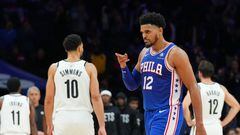 Tobias Harris #12 of the Philadelphia 76ers reacts in front of Ben Simmons #10 of the Brooklyn Nets in the fourth quarter of the game at the Wells Fargo Center on November 22, 2022 in Philadelphia, Pennsylvania. The 76ers defeated the Nets 115-106.