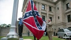 The state flag is raised for the flag retirement ceremony at the Mississippi State Capitol building in Jackson, Mississippi on July 1, 2020. - Mississippi&#039;s flag, the last US state banner to feature a Confederate emblem, was permanently retired Wedne