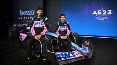 French drivers Pierre Gasly (L) and Esteban Ocon pose with their new BWT Alpine A523 Formula One racing car during the team's 2023 season launch, in London on February 16, 2023. (Photo by Daniel LEAL / AFP)