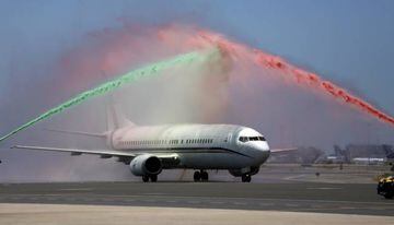 Portugal's winning EURO 2016 team plane passes under an honorary arch from fire hoses as it taxies on the runway on return to Lisbon, Portugal, July 11, 2016. REUTERS/Rafael Marchante