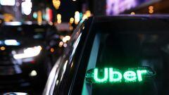 FILE PHOTO: An unauthorised device displays a version of the Uber logo on a vehicle in Manhattan, New York City, New York, U.S., November 17, 2021. REUTERS/Andrew Kelly/File Photo
