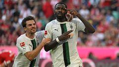 27 August 2022, Bavaria, Munich: Soccer, Bundesliga, Matchday 4, Bayern Munich - Bor. Mönchengladbach, Allianz Arena: Mönchengladbach striker Marcus Thuram celebrates his goal to make it 0:1. Mönchengladbach midfielder Jonas Hofmann is on the left. IMPORTANT NOTE: In accordance with the regulations of the DFL Deutsche Fußball Liga and the DFB Deutscher Fußball-Bund, it is prohibited to use or have used photographs taken in the stadium and/or of the match in the form of sequence pictures and/or video-like photo series. Photo: Sven Hoppe/dpa (Photo by Sven Hoppe/picture alliance via Getty Images)