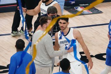 Luka Doncic and Santi Aldama greet each other after a game.