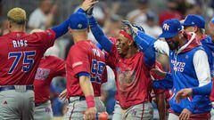 MIAMI, FLORIDA - MARCH 15: Francisco Lindor #12 of Puerto Rico celebrates with teammates after he scored during the fifth inning of the World Baseball Classic Pool D game against the Dominican Republic at loanDepot park on March 15, 2023 in Miami, Florida.   Eric Espada/Getty Images/AFP (Photo by Eric Espada / GETTY IMAGES NORTH AMERICA / Getty Images via AFP)