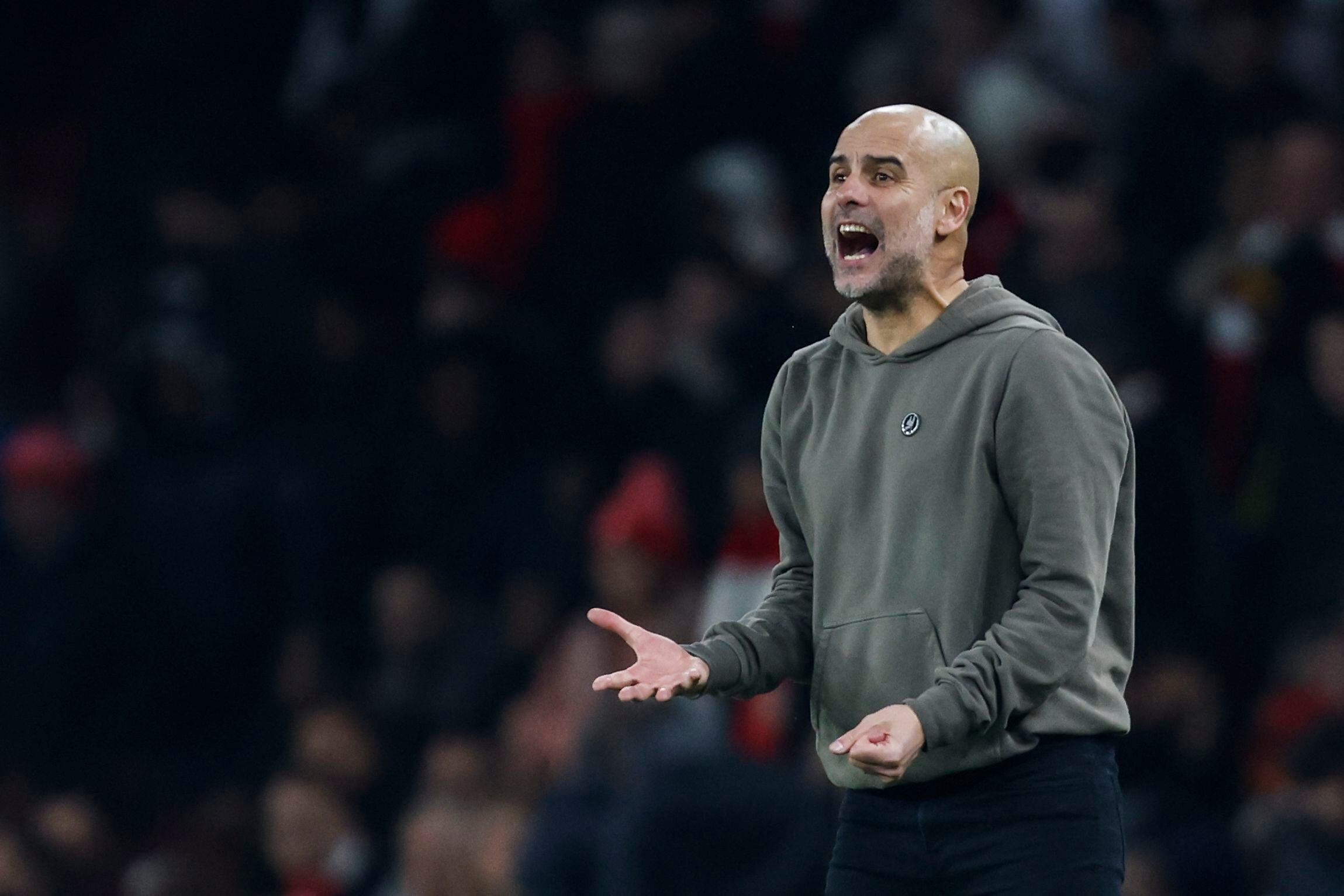 Manchester City's Spanish manager Pep Guardiola during the English Premier League football match between Arsenal and Manchester City at the Emirates Stadium in London on February 15, 2023. (Photo by Ian Kington / IKIMAGES / AFP) / RESTRICTED TO EDITORIAL USE. No use with unauthorized audio, video, data, fixture lists, club/league logos or 'live' services. Online in-match use limited to 120 images. An additional 40 images may be used in extra time. No video emulation. Social media in-match use limited to 120 images. An additional 40 images may be used in extra time. No use in betting publications, games or single club/league/player publications. / 