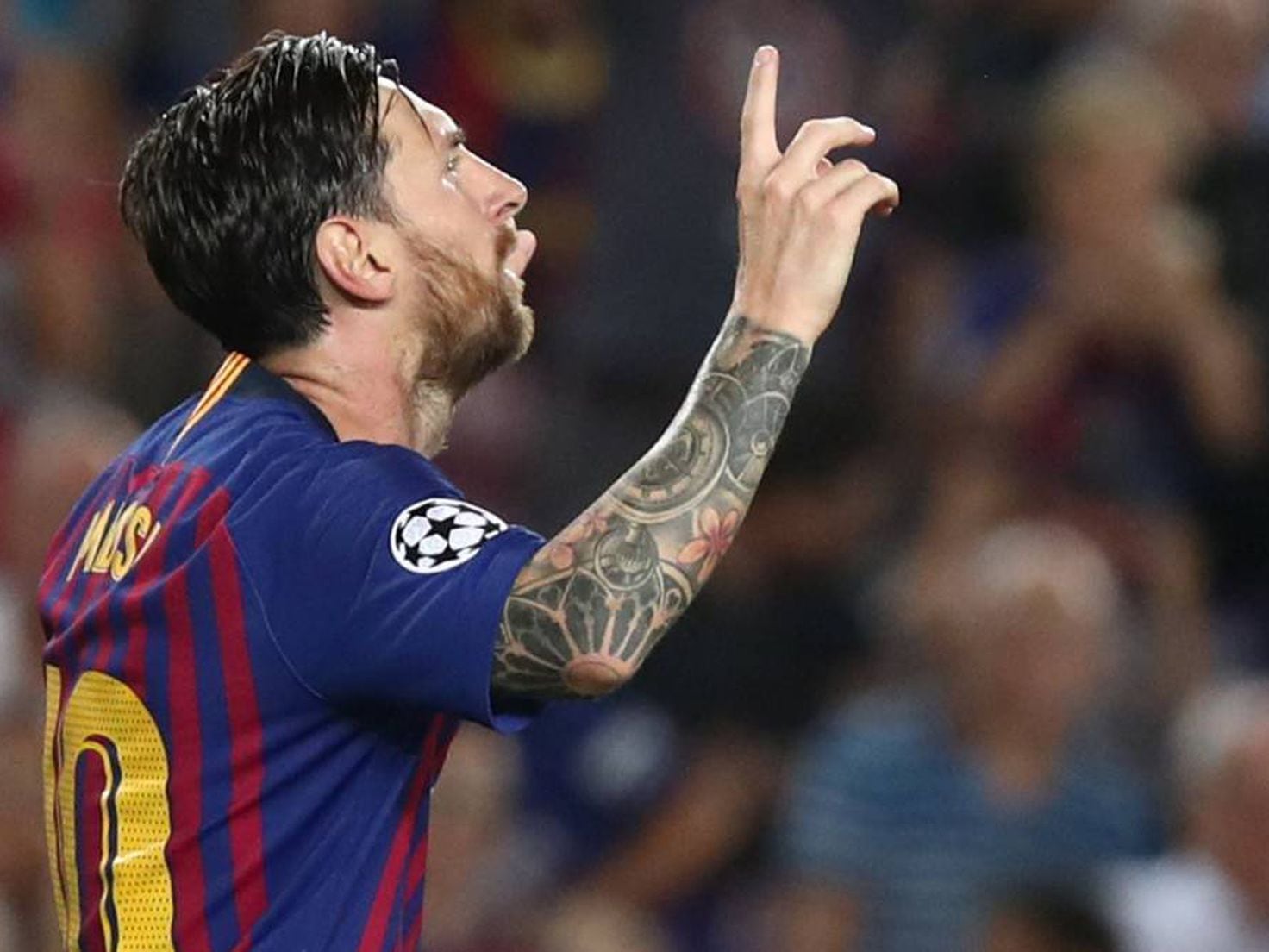 Lionel messi lifting the 2018/19 champions league trophy for barcelona  against tottenham