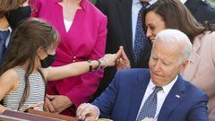 Kamala Harris‬ and Joe Biden interact with family members of fallen police officers as Biden signs into law an act to award four Congressional Gold Medals to the United States Capitol Police, Washington Metro Police and those who protected the U.S. Capito