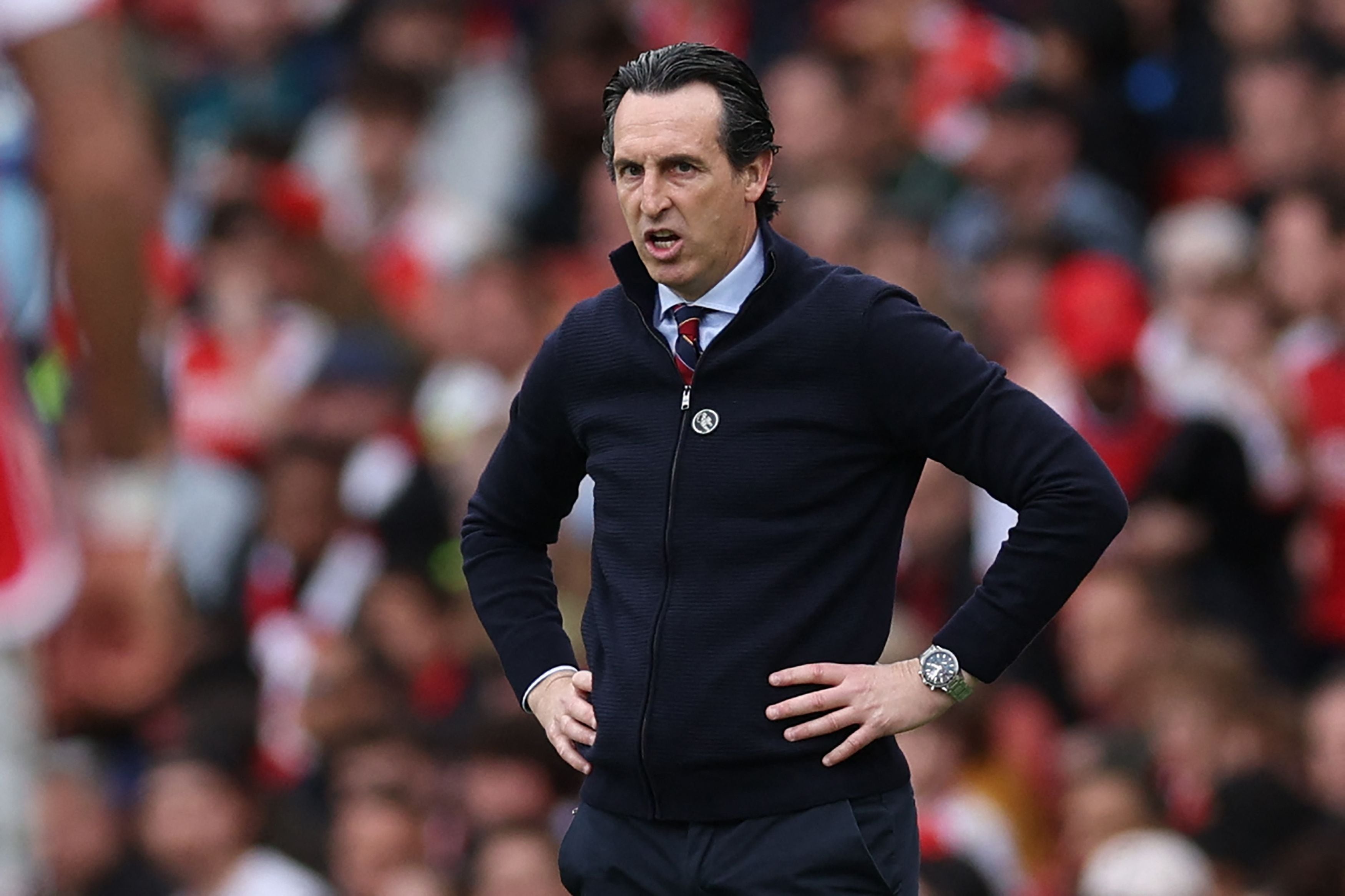 Aston Villa's Spanish head coach Unai Emery looks on during the English Premier League football match between Arsenal and Aston VIlla at the Emirates Stadium in London on April 14, 2024. (Photo by Adrian DENNIS / AFP) / RESTRICTED TO EDITORIAL USE. No use with unauthorized audio, video, data, fixture lists, club/league logos or 'live' services. Online in-match use limited to 120 images. An additional 40 images may be used in extra time. No video emulation. Social media in-match use limited to 120 images. An additional 40 images may be used in extra time. No use in betting publications, games or single club/league/player publications. / 