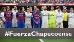 Barcelona and Real Madrid players observe a minute of silence to remember the air crash victims of the Chapecoense football team before the Spanish league football match FC Barcelona vs Real Madrid CF at the Camp Nou stadium in Barcelona on December 3, 20
