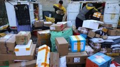 Delivery workers sort parcels at a makeshift logistics station near the Central Business District (CBD) during Singles&rsquo; Day shopping festival in Beijing, China November 11, 2021. 