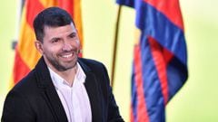 Barcelona&#039;s Argentinian forward Kun Aguero smiles as he addresses a press conference to announce his retirement from football, at the Camp Nou stadium in Barcelona, on December 15, 2021.