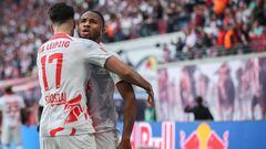 Leipzig's Hungarian midfielder Dominik Szoboszlai (L) celebrates scoring the 2-1 goal with Leipzig's French forward Christopher Nkunku during the German first division Bundesliga football match between RB Leipzig and Werder Bremen in Leipzig on May 14, 2023. (Photo by Ronny HARTMANN / AFP) / DFL REGULATIONS PROHIBIT ANY USE OF PHOTOGRAPHS AS IMAGE SEQUENCES AND/OR QUASI-VIDEO